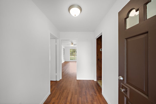 115 Old Caney Rd, Wharton, TX 77488 - corridor featuring dark wood-style flooring and baseboards
