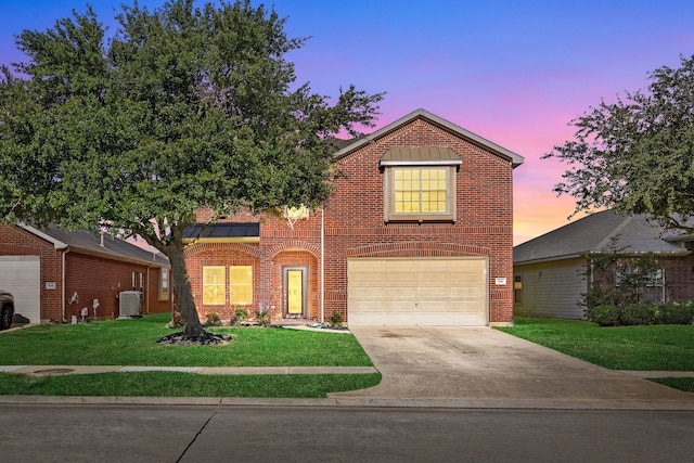 506 Stream Mill Ln, Katy, TX 77494 - traditional-style house with brick siding, driveway, a front lawn, and a garage