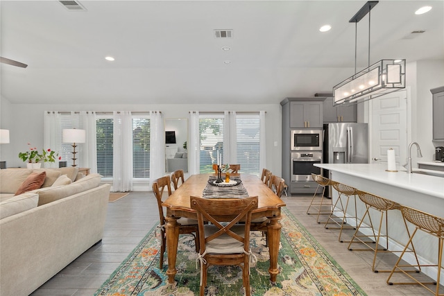 dining area featuring recessed lighting and light wood-type flooring
