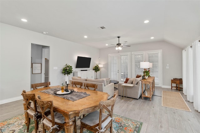 dining space with ceiling fan, light wood-style flooring, baseboards, recessed lighting, and vaulted ceiling