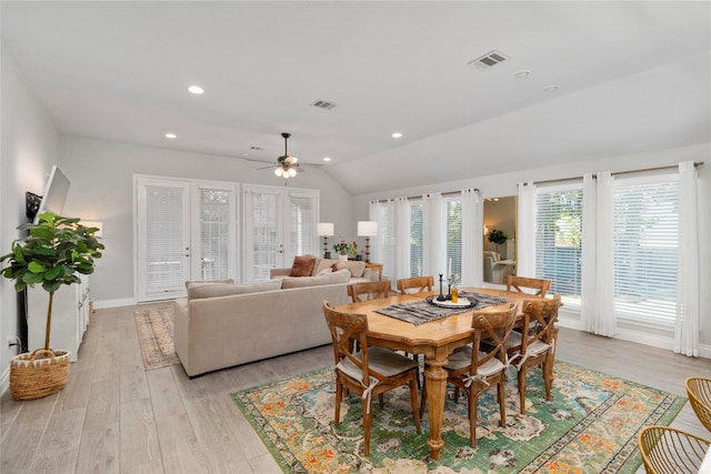 dining space featuring vaulted ceiling, light wood-style floors, ceiling fan, baseboards, and recessed lighting