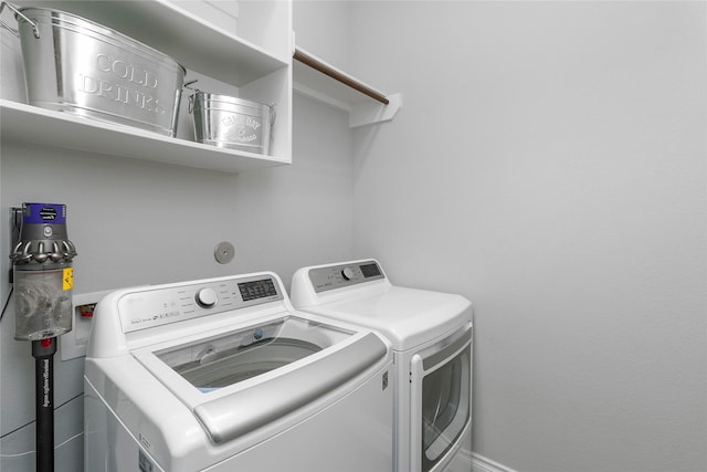 washroom featuring independent washer and dryer