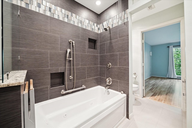 6549 Bayou Glen Rd, Houston, TX 77057 - full bathroom with toilet, a combined bath / shower with jetted tub, tile patterned floors, baseboards, and vanity