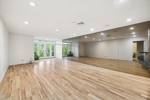 6549 Bayou Glen Rd, Houston, TX 77057 - unfurnished living room featuring light wood-style floors and recessed lighting