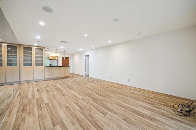 6549 Bayou Glen Rd, Houston, TX 77057 - unfurnished living room featuring light wood-style floors and recessed lighting