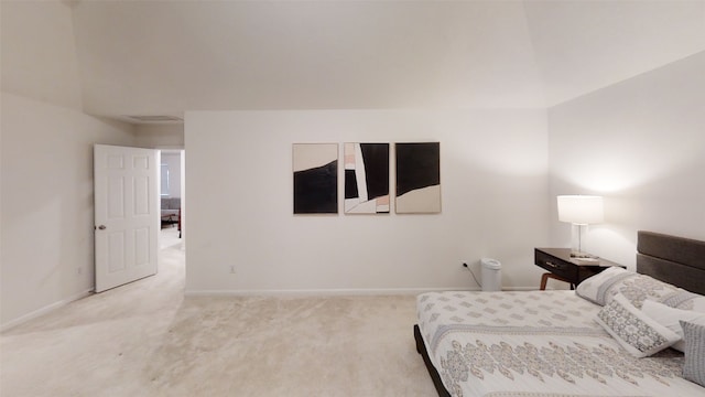 carpeted bedroom featuring baseboards