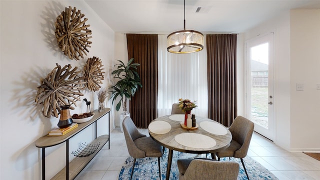 dining space with light tile patterned floors and baseboards