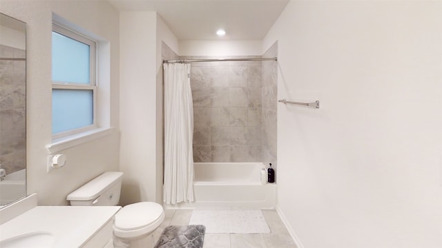 full bathroom featuring tile patterned floors, shower / bath combo with shower curtain, vanity, toilet, and baseboards