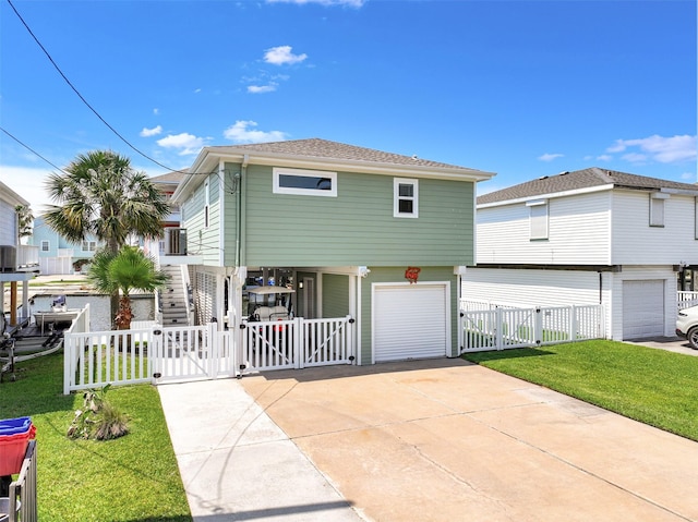 16716 Tahiti Way, Galveston, TX 77554 - view of front of house featuring a gate, a garage, and driveway