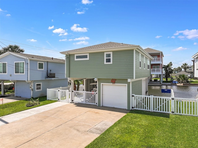 16716 Tahiti Way, Galveston, TX 77554 - raised beach house with a gate, a garage, driveway, and a water view