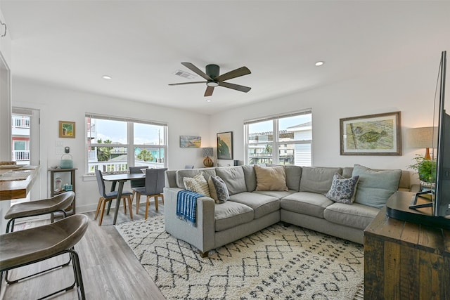 16716 Tahiti Way, Galveston, TX 77554 - living area with ceiling fan, light wood-style flooring, healthy amount of natural light, recessed lighting, and baseboards