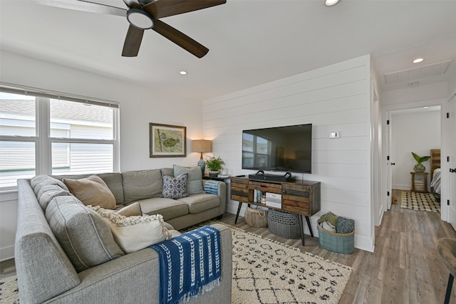 16716 Tahiti Way, Galveston, TX 77554 - living room featuring a ceiling fan, recessed lighting, wood finished floors, and wood walls