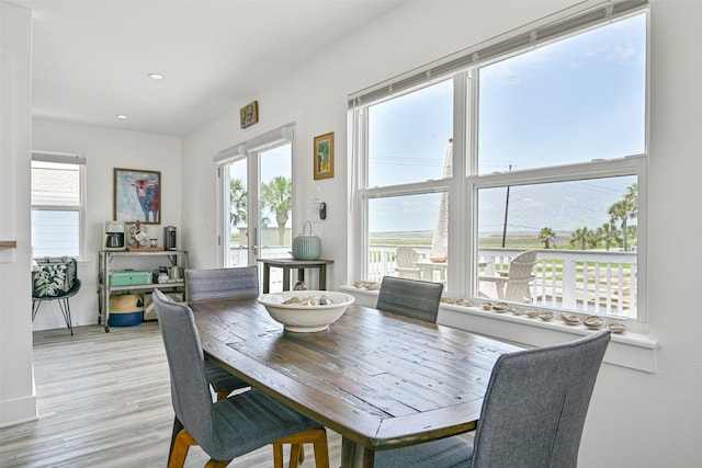 16716 Tahiti Way, Galveston, TX 77554 - dining area with healthy amount of natural light, light wood-type flooring, recessed lighting, and baseboards