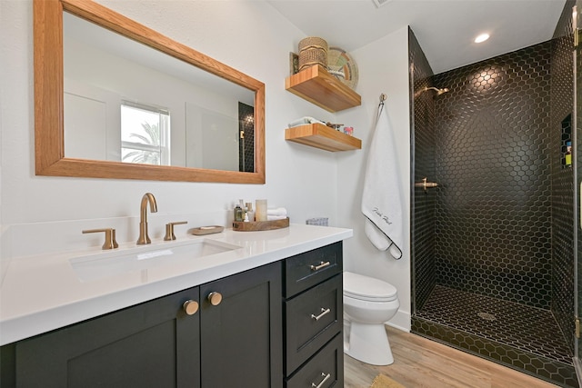 16716 Tahiti Way, Galveston, TX 77554 - full bath featuring toilet, wood finished floors, vanity, a tile shower, and recessed lighting