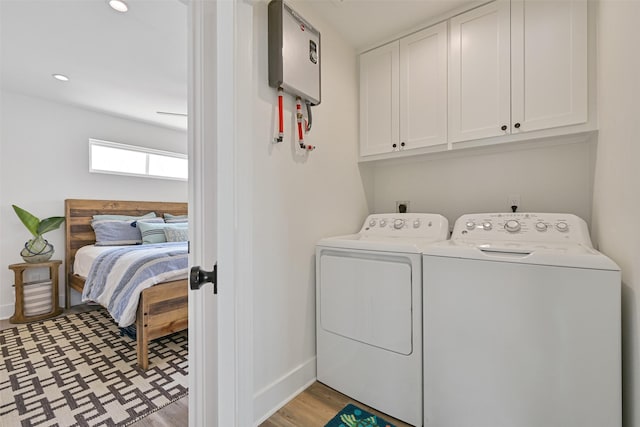 16716 Tahiti Way, Galveston, TX 77554 - laundry area featuring cabinet space, washer and dryer, baseboards, light flooring, and recessed lighting