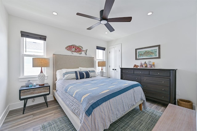 16716 Tahiti Way, Galveston, TX 77554 - bedroom featuring multiple windows, wood finished floors, recessed lighting, and a closet