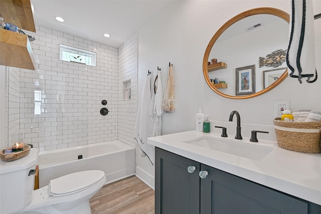 16716 Tahiti Way, Galveston, TX 77554 - bathroom with toilet, wood finished floors, vanity, bathtub / shower combination, and recessed lighting