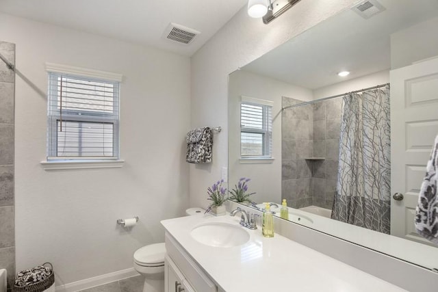13814 Russell Ct, Mont Belvieu, TX 77523 - bathroom featuring curtained shower, toilet, baseboards, vanity, and tile patterned flooring