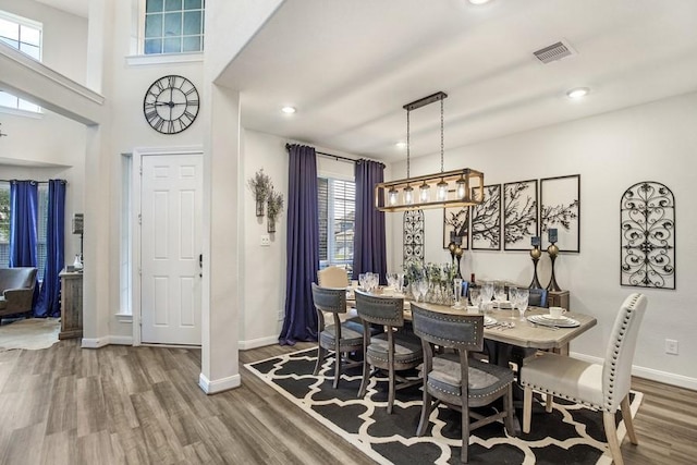 13814 Russell Ct, Mont Belvieu, TX 77523 - dining space with wood finished floors, baseboards, and recessed lighting