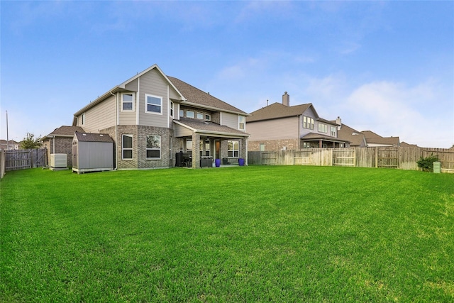 13814 Russell Ct, Mont Belvieu, TX 77523 - rear view of house with a shed, an outbuilding, and brick siding