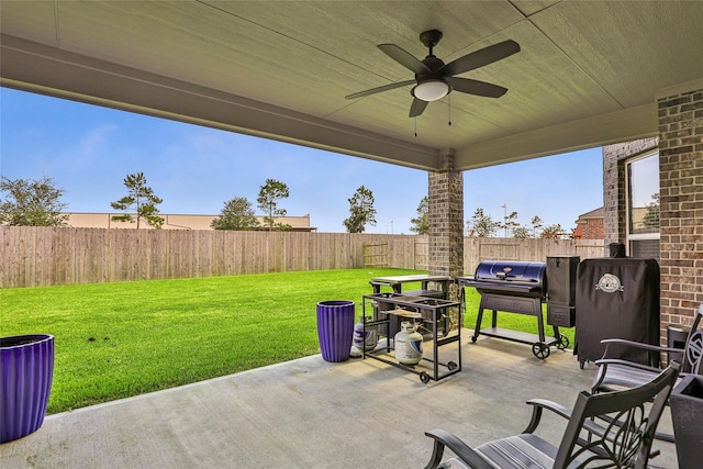 13814 Russell Ct, Mont Belvieu, TX 77523 - view of patio featuring a ceiling fan and grilling area
