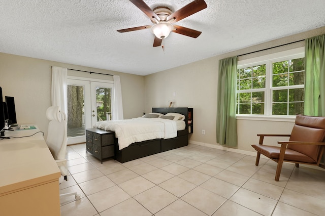 105 N Delmont Dr E, Conroe, TX 77301 - bedroom with french doors, access to exterior, a textured ceiling, light tile patterned floors, and a ceiling fan