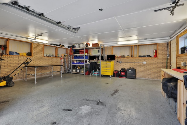 105 N Delmont Dr E, Conroe, TX 77301 - garage featuring a workshop area