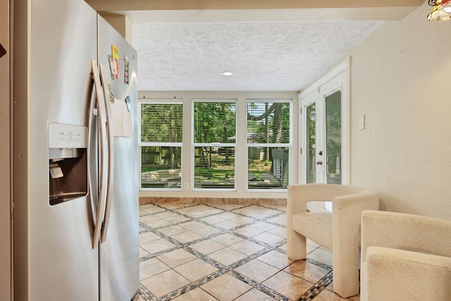 105 N Delmont Dr E, Conroe, TX 77301 - doorway to outside with inlaid floor details and a textured ceiling