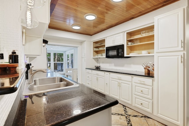 105 N Delmont Dr E, Conroe, TX 77301 - kitchen with open shelves, wooden ceiling, black microwave, a sink, and white cabinets