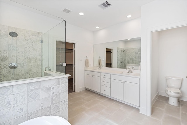 bathroom with a stall shower, recessed lighting, double vanity, baseboards, and tile patterned flooring