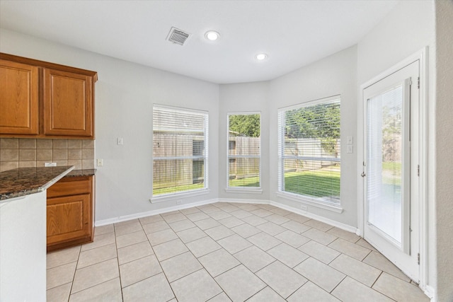 15127 Woodford Hollow Ln, Cypress, TX 77429 - unfurnished dining area with recessed lighting, baseboards, and light tile patterned floors