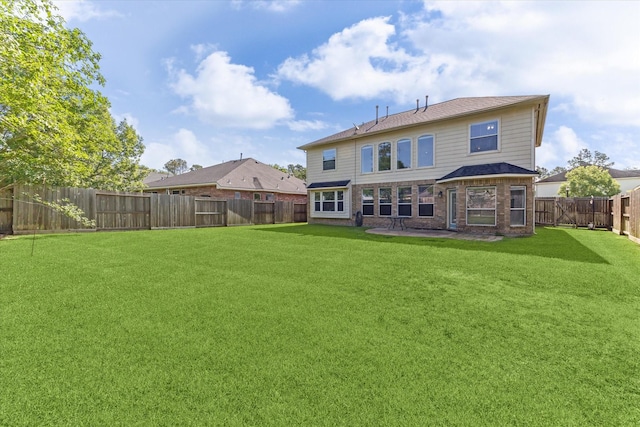 15127 Woodford Hollow Ln, Cypress, TX 77429 - back of property featuring brick siding and a patio area