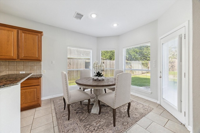 15127 Woodford Hollow Ln, Cypress, TX 77429 - dining room featuring light tile patterned flooring, recessed lighting, and baseboards