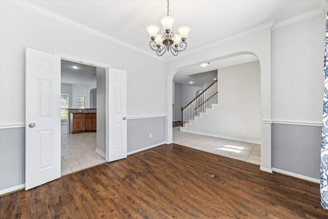 15127 Woodford Hollow Ln, Cypress, TX 77429 - unfurnished room with arched walkways, tile patterned flooring, a chandelier, crown molding, and baseboards
