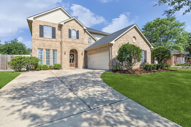 15127 Woodford Hollow Ln, Cypress, TX 77429 - view of front of house featuring brick siding, driveway, and a garage