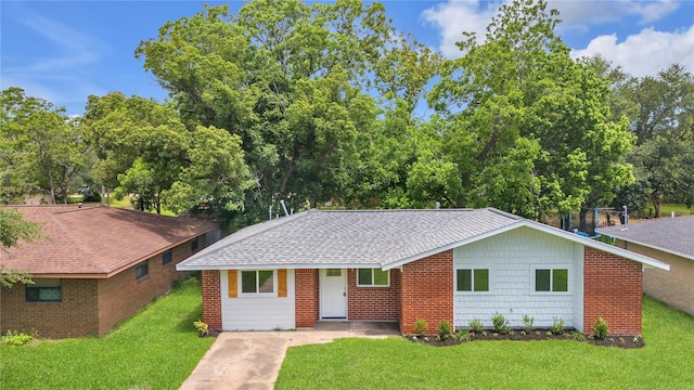 110 Prune St, La Marque, TX 77568 - view of front of property featuring a front lawn and a shingled roof