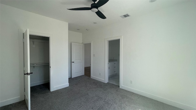 9316 Waller St, Houston, TX 77012 - unfurnished bedroom with carpet flooring, a walk in closet, a closet, and baseboards