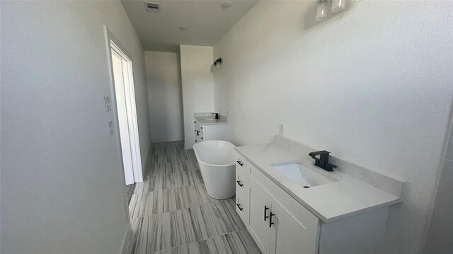 9316 Waller St, Houston, TX 77012 - bathroom featuring vanity and a freestanding bath