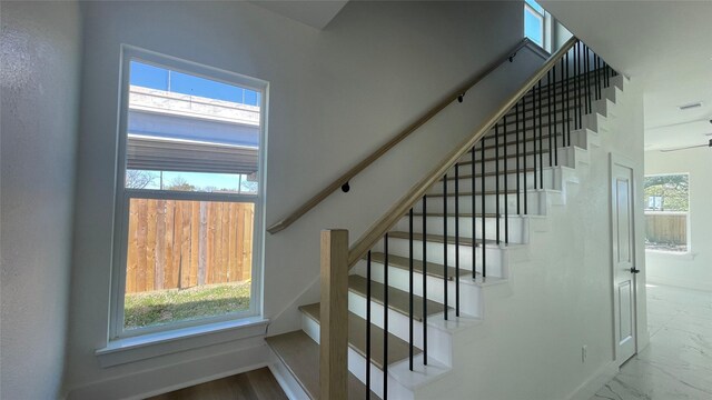 9316 Waller St, Houston, TX 77012 - stairs with baseboards and marble finish flooring