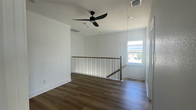 9316 Waller St, Houston, TX 77012 - empty room with wood finished floors, baseboards, and ceiling fan