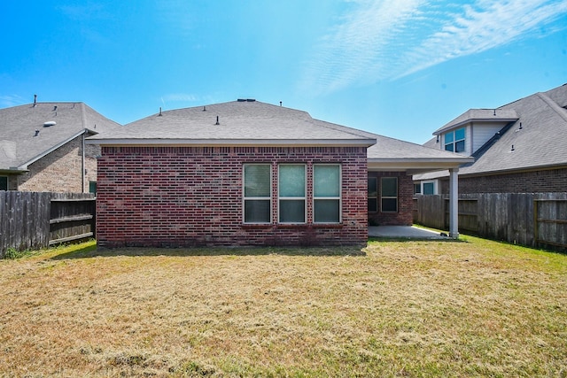 back of house featuring a patio and brick siding