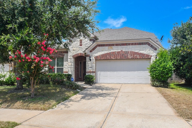 view of front facade with stone siding, an attached garage, and concrete driveway