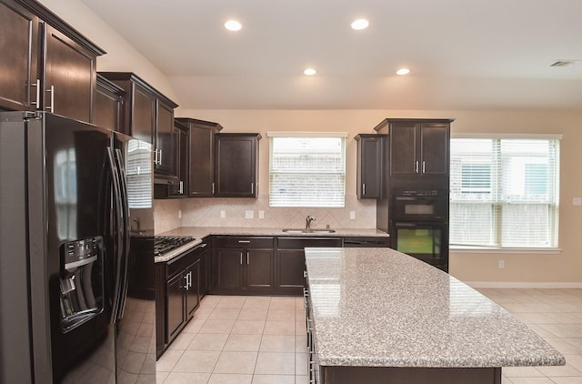 kitchen with black appliances, light tile patterned floors, backsplash, recessed lighting, and dark brown cabinets