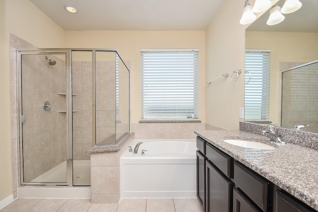 full bath featuring healthy amount of natural light, a shower stall, and tile patterned flooring