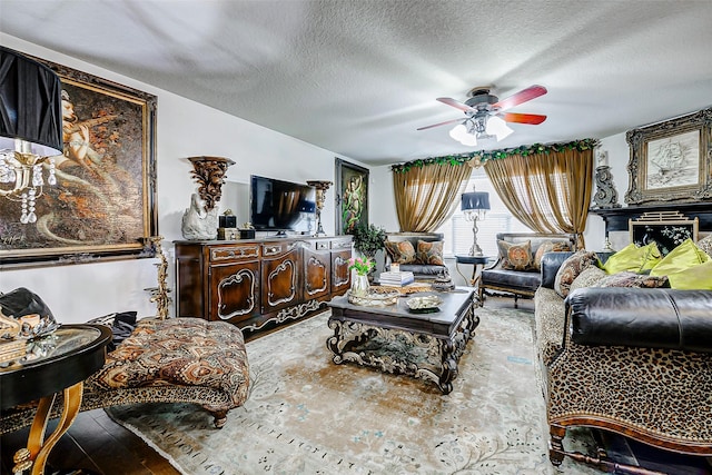 13600 Breton Ridge St Unit 25B, Houston, TX 77070 - living area featuring ceiling fan, wood-type flooring, and a textured ceiling