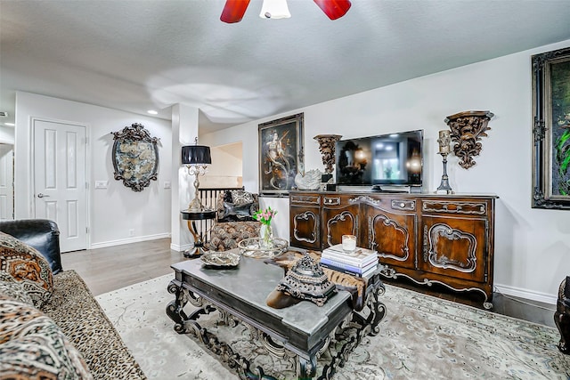 13600 Breton Ridge St Unit 25B, Houston, TX 77070 - living room featuring wood finished floors, ceiling fan, baseboards, and recessed lighting