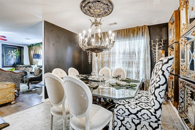 13600 Breton Ridge St Unit 25B, Houston, TX 77070 - dining area featuring a chandelier and tile patterned flooring