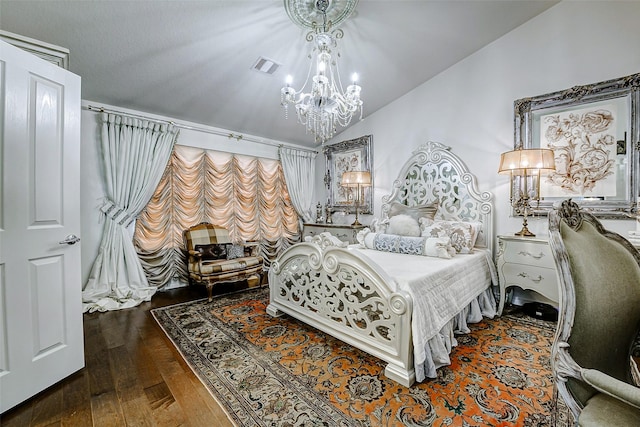 13600 Breton Ridge St Unit 25B, Houston, TX 77070 - bedroom with a chandelier, hardwood / wood-style floors, and vaulted ceiling