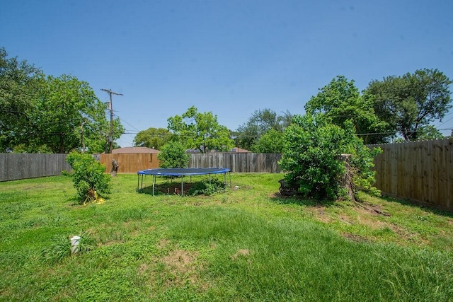 view of yard featuring a trampoline