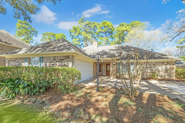 12514 Wealdstone Dr, Tomball, TX 77377 - ranch-style home featuring brick siding, a garage, and a chimney